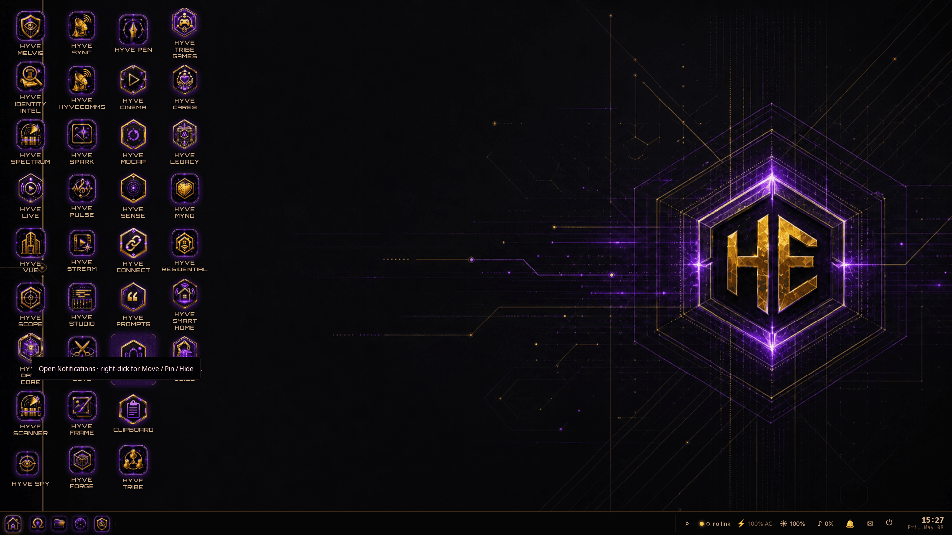 HYVE Ether OS desktop with the central HE hexagon logo and purple circuit-board lines flowing from the corners of the screen, plus a notification overlay near the bottom of the icon grid.
